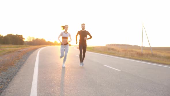 Healthy Lifestyle - Woman and Man Running. alt