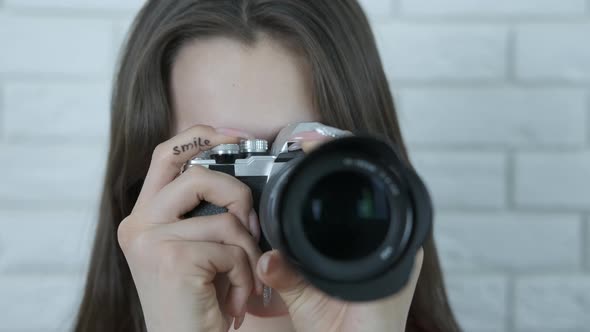 Girl Photographer with a Camera alt