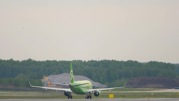 Jet Airliner Picks Up Speed and Takes Off