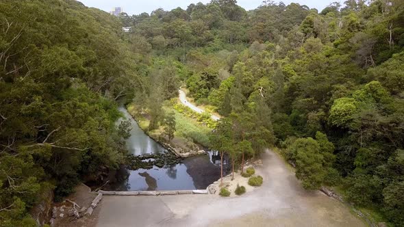 Aerial flyover of Flat Rock Creek canyon in Northbridge just past the Long Gully Bridge, Sydney Aust alt