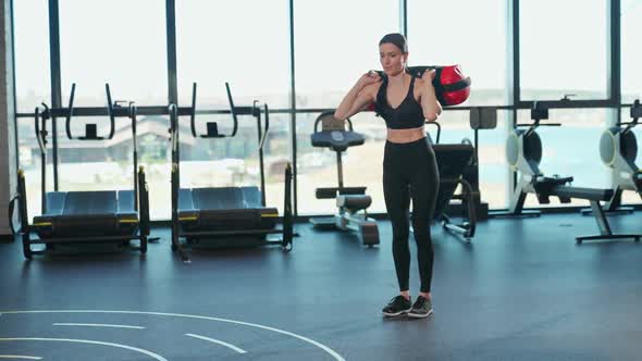 Motivation Athletic Female Perform Squats with Weights Muscle Training with Weighting in Gym Woman alt