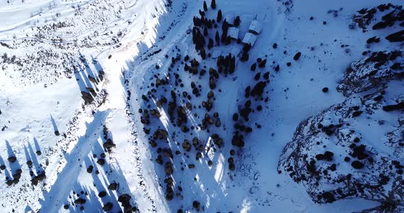 A Group of People Climb a Snow Path in the Gorge alt
