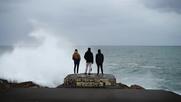 Young Guys Look at Waves in the Ocean 2 alt