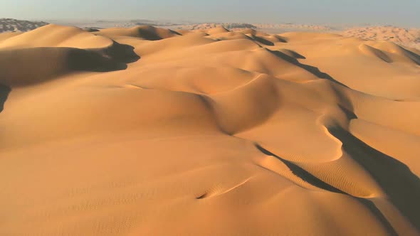 Aerial Shot of Sand Dunes in Arabian Desert - Empty Quarter in Oman alt