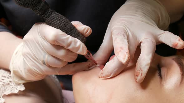 Cosmetologist Making Lips Microblading Permanent Procedure Using Tattoo Machine Pink Pigment alt