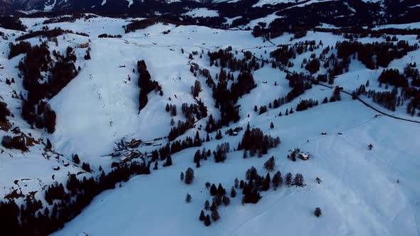 Aerial pan up shot from Alpe di Siusi in the Italian Alps alt