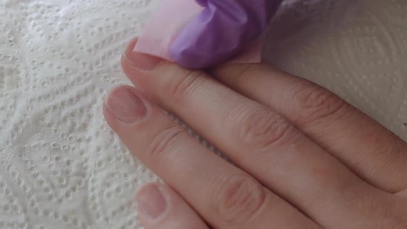 Close Up Woman Remove Old Gel From Nails with Nail File. Woman Getting Nail Manicure.