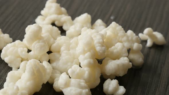 Lactobacillus species lactic acid bacteria and yeasts kephyr on wooden table  slow pan 4K 2160p 30fp alt