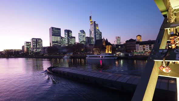 Germany, Frankfurt, Financial District and cargo ship on Main river alt