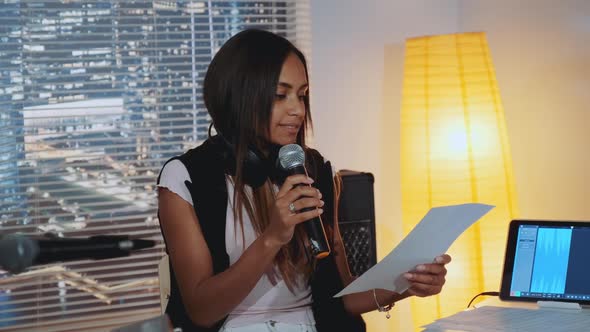 Female Black Vocalist Finding Mistakes in Musical Notes of the Song During Rehearsal alt