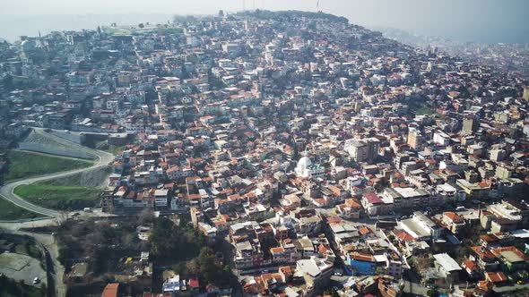 Drone view on poverty slum district and muslim mosque alt