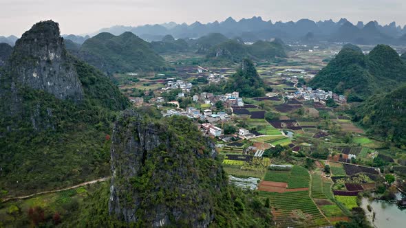 Aerial of the rock formations and towns along the Li River in China alt