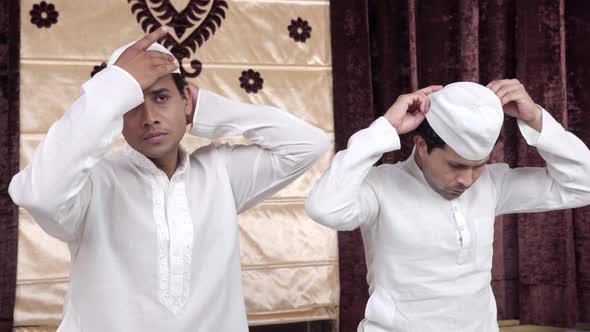 Muslim men getting ready for Ramadan prayer alt