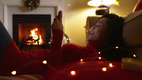 Woman at home at Christmas time alt