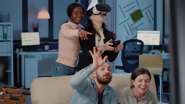 Colleagues Enjoying Video Games with Vr Glasses and Joystick alt