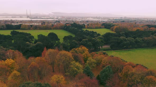 Cinematic aerial view above Saint Anne's Park in Dublin. alt