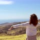 Woman worshipping with hands in the air on top of the mountain - VideoHive Item for Sale