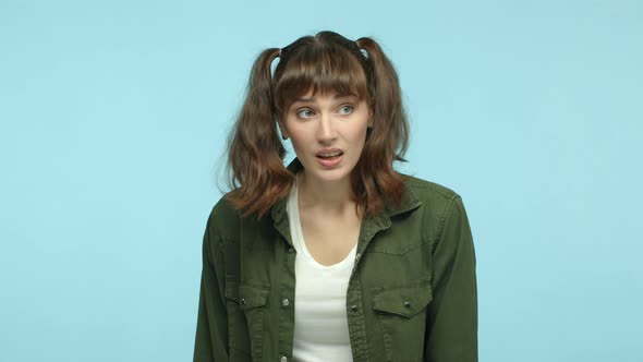 Slow Motion of Silly Woman with Double Ponytails Hairstyle Listening and Nodding Understanding