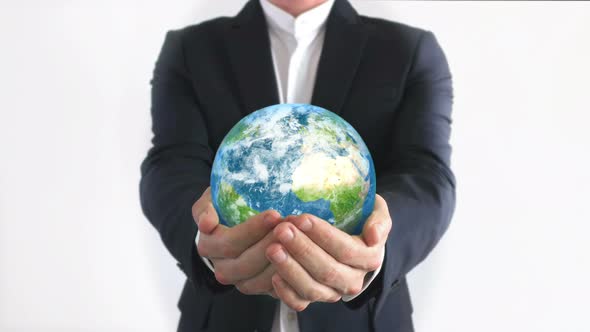 Businessman Holding the Planet in Hands
