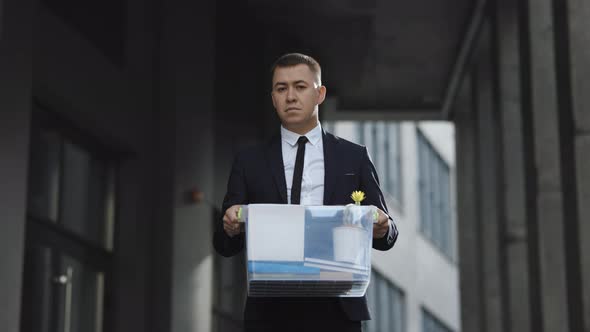 Portrait Sad Male Office Worker in Depression With Box of Personal Stuff