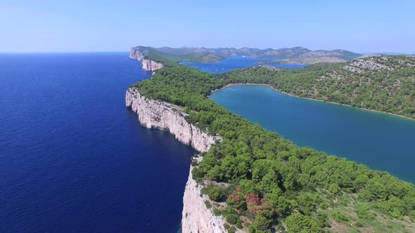 Panoramic view of cliffs and a beautiful salty lake on Dalmatian coast alt