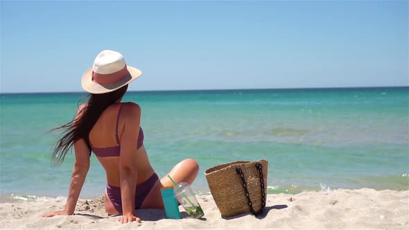 Young Woman in Hat on the Beach Vacation
