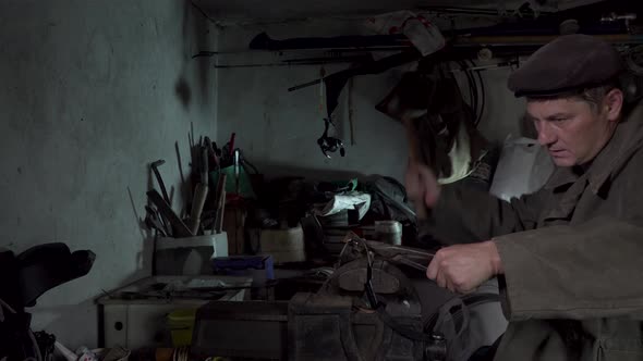 A Man Works in an Old Home Workshop alt
