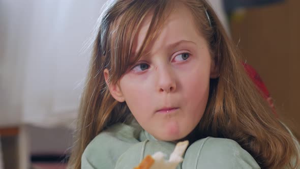 Girl Eating Bread Closeup alt