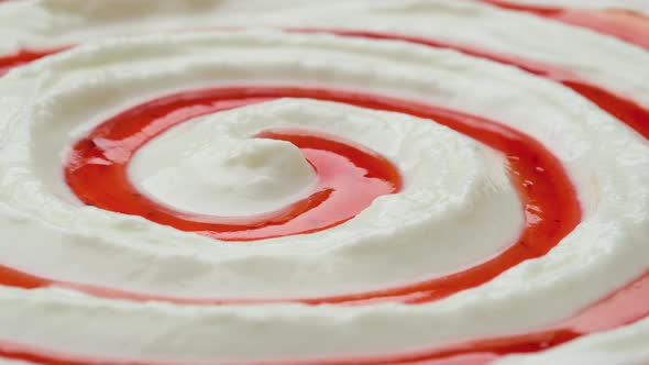 Close up of yogurt with fruit jam, curd cream swirl with berry topping alt