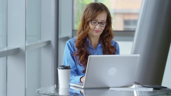 Young businesswoman working on laptop computer