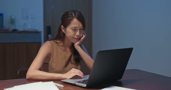Woman Feel Annoy of Using Laptop Computer at Home in The Evening alt