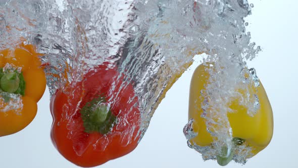 Bell peppers splashing into water in slow motion; shot on Phantom Flex 4K at 1000 fps