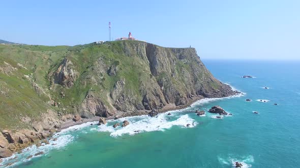 Sea view of lighthouse at Cabo da Roca cape, westernmost extent of mainland Portugal and continental alt