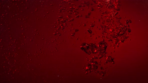 Super Slow Motion Shot of Red Wine Bubble Background at 1000Fps alt