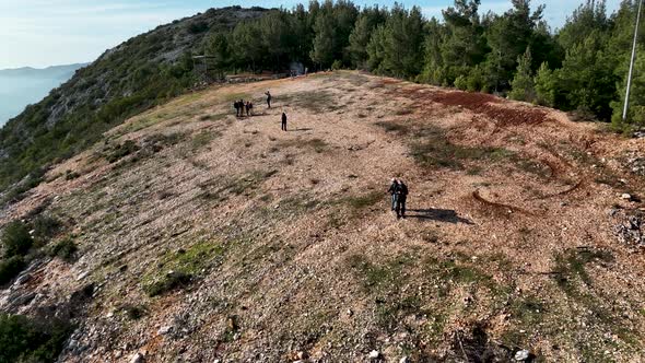 Travelers go on a hike aerial view 4 K alt