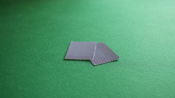 A man receives a winning hand of cards from a black jack dealer in a casino. He has ace and king twe alt