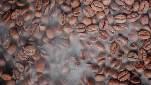 Close Up of Seeds of Coffee. Fragrant Coffee Beans Are Roasted Smoke Comes From Coffee Beans alt