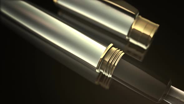 Close-up of a classic fountain pen with a cap and gold and silver design. alt