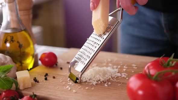 Making Pasta Carbonara  Grating Parmesan Cheese on Wooden Cutting Board alt