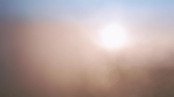 Drone Flying in Fog Above Beautiful Ocean of Pink Clouds at Scenic Sunset alt