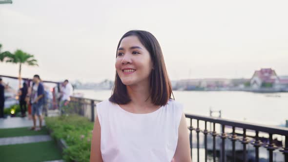 Asian woman blogger tourist with casual style walking with smiling on street joyful. alt