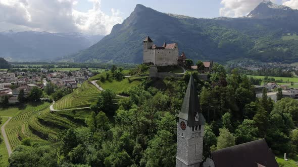 Aerial shot of St. Nikolaus church and Gutenberg Castle, Balzers, Liechtenstein alt