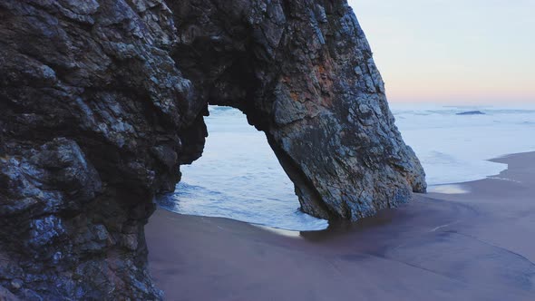 Aerial Drone View of Lisbon Beach with Arch Rock Formation, on the Portugal Coast by Sintra at Praia alt