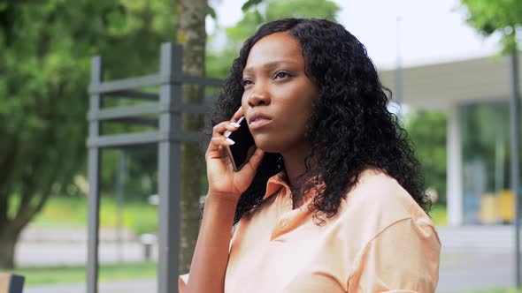 African American Woman Calling on Smartphone alt