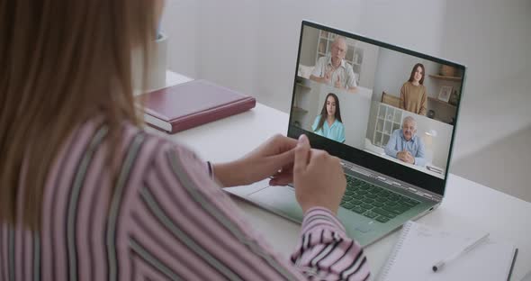 Back View of Business Woman Talking To Her Colleagues About Plan in Video Conference. Multiethnic alt