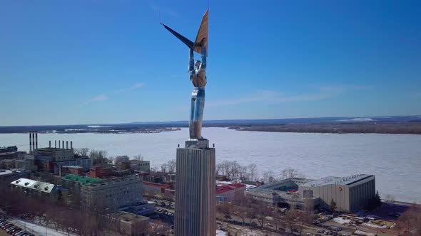 Monument of Glory in Samara City Aerial View at Sunny Weather Flying Around Statue