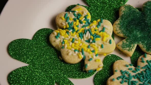 Rotating stock footage shot of St Patty's Day clovers on a white surface - ST PATTYS 011 alt