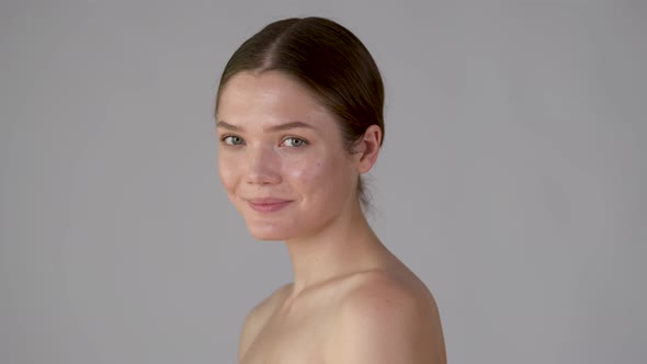 Close-up portrait of joyful girl looking at camera, isolated on white background. alt