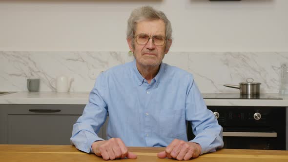 Happy Elderly Senior Adult Grayhaired Man Smiling Face White Healthy Teeth Dental Smile Sit on Sofa alt