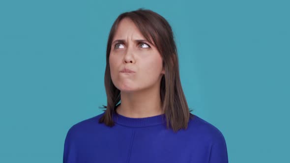 Portrait of Concentrated Brunette Female 30s Biting Lips Thinking About Things Doubting Suddenly alt